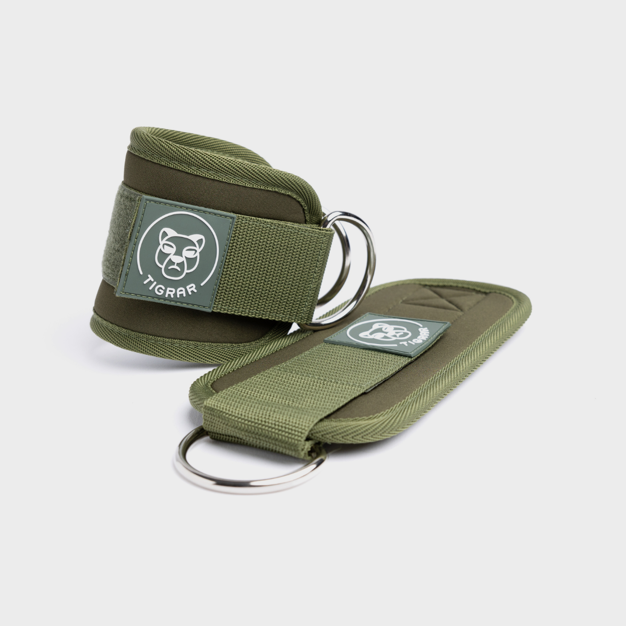 Groene Tigrar enkelbanden met verstelbare straps en zachte voering voor extra comfort. Verbetert stabiliteit en balans. Geschikt voor krachttraining oefeningen.