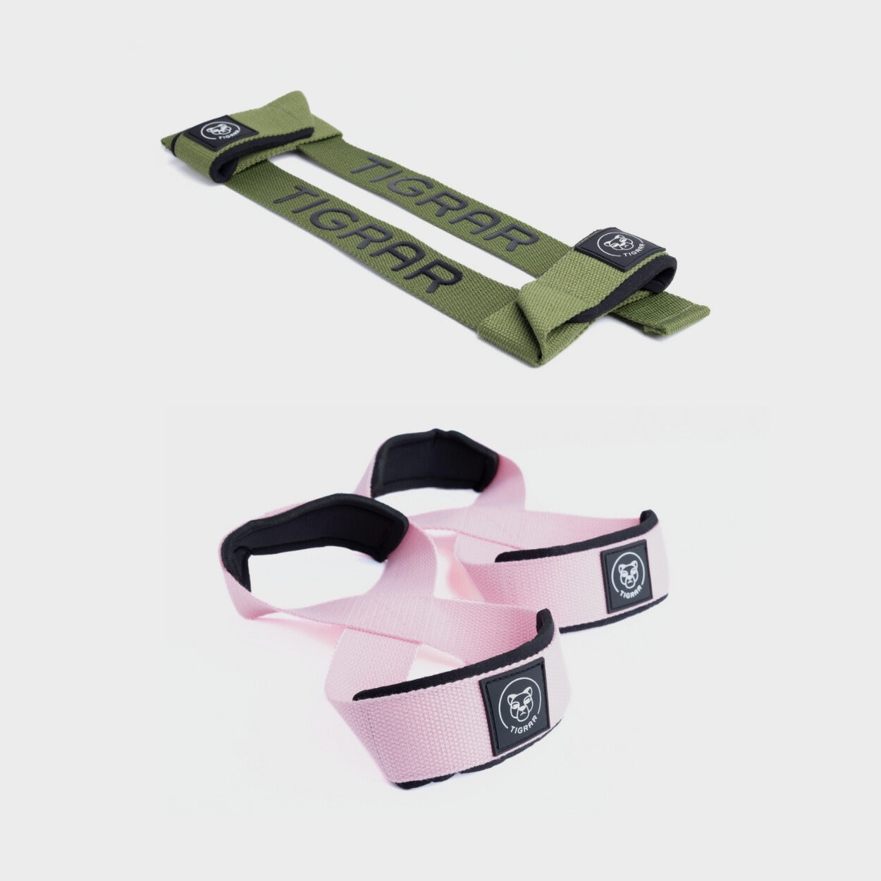 Groene lifting straps met roze figure 8 straps, perfect voor een stabiele en kleurrijke krachttraining.