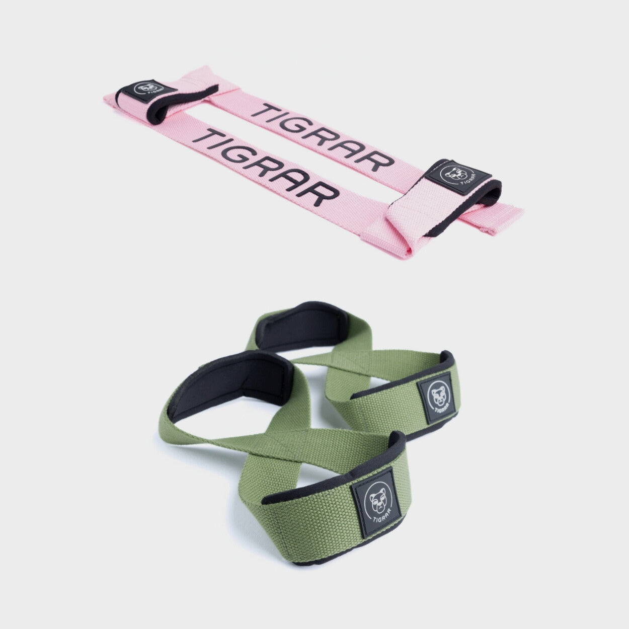 Roze lifting straps met groene figure 8 straps, voor een levendige en comfortabele grip bij zware liften.